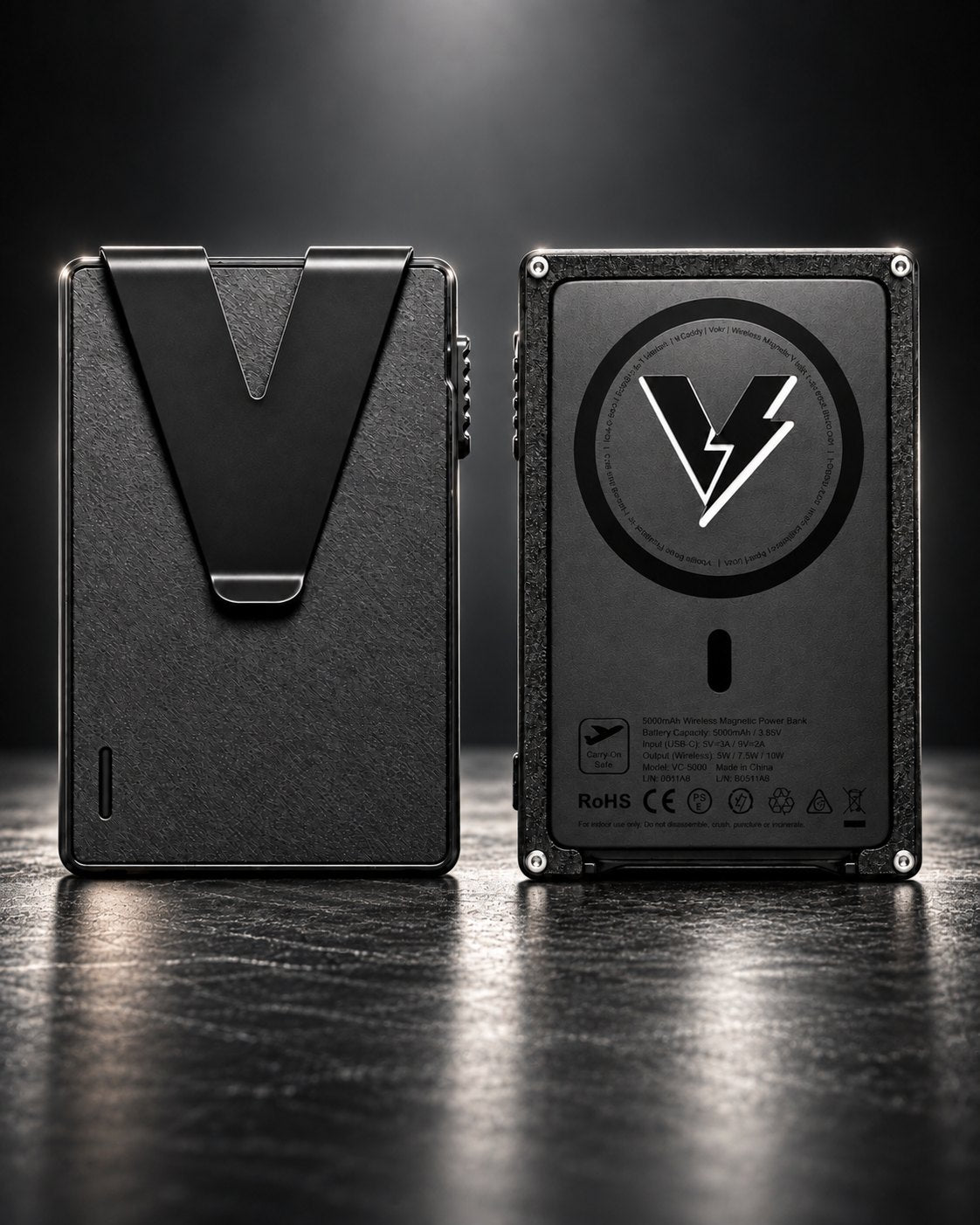 Volt Caddy ONE wallet, front and back, on a dark reflective surface